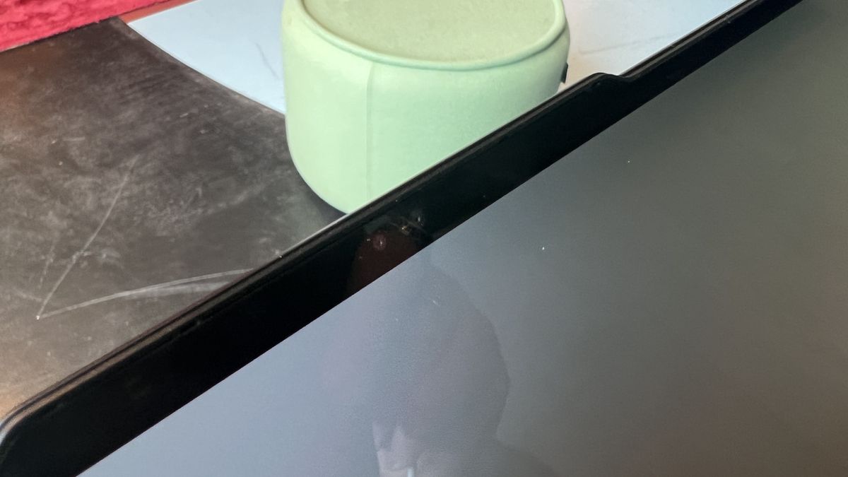blue laptop on table