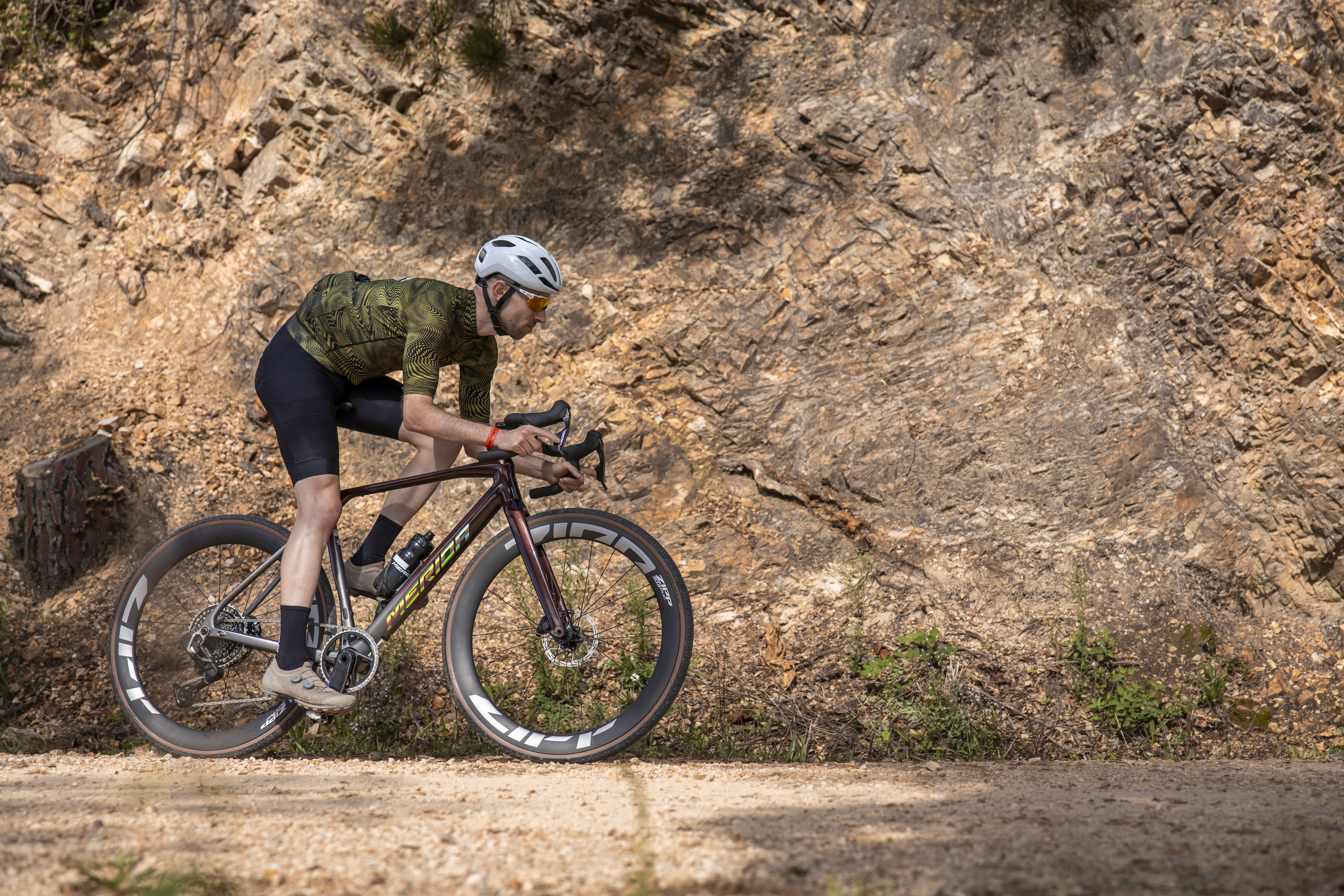 A man riding a Merida Mission gravel bike
