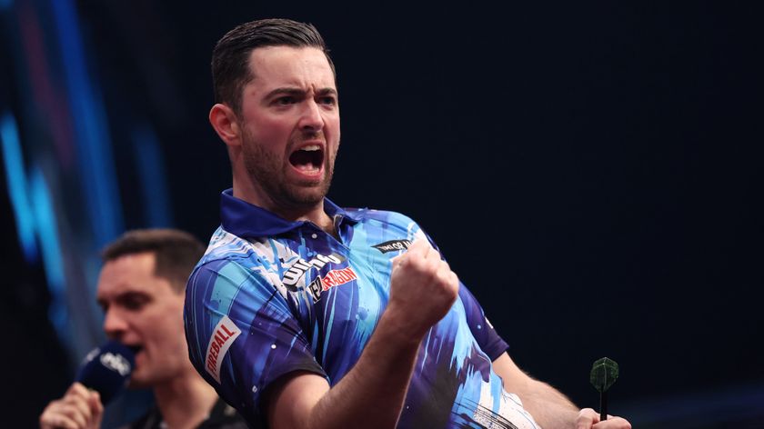 Luke Humphries celebrates winning his Semi-Final match against Gian van Veen during Day 4 of the 2026 Winmau World Masters Darts at Arena MK. 