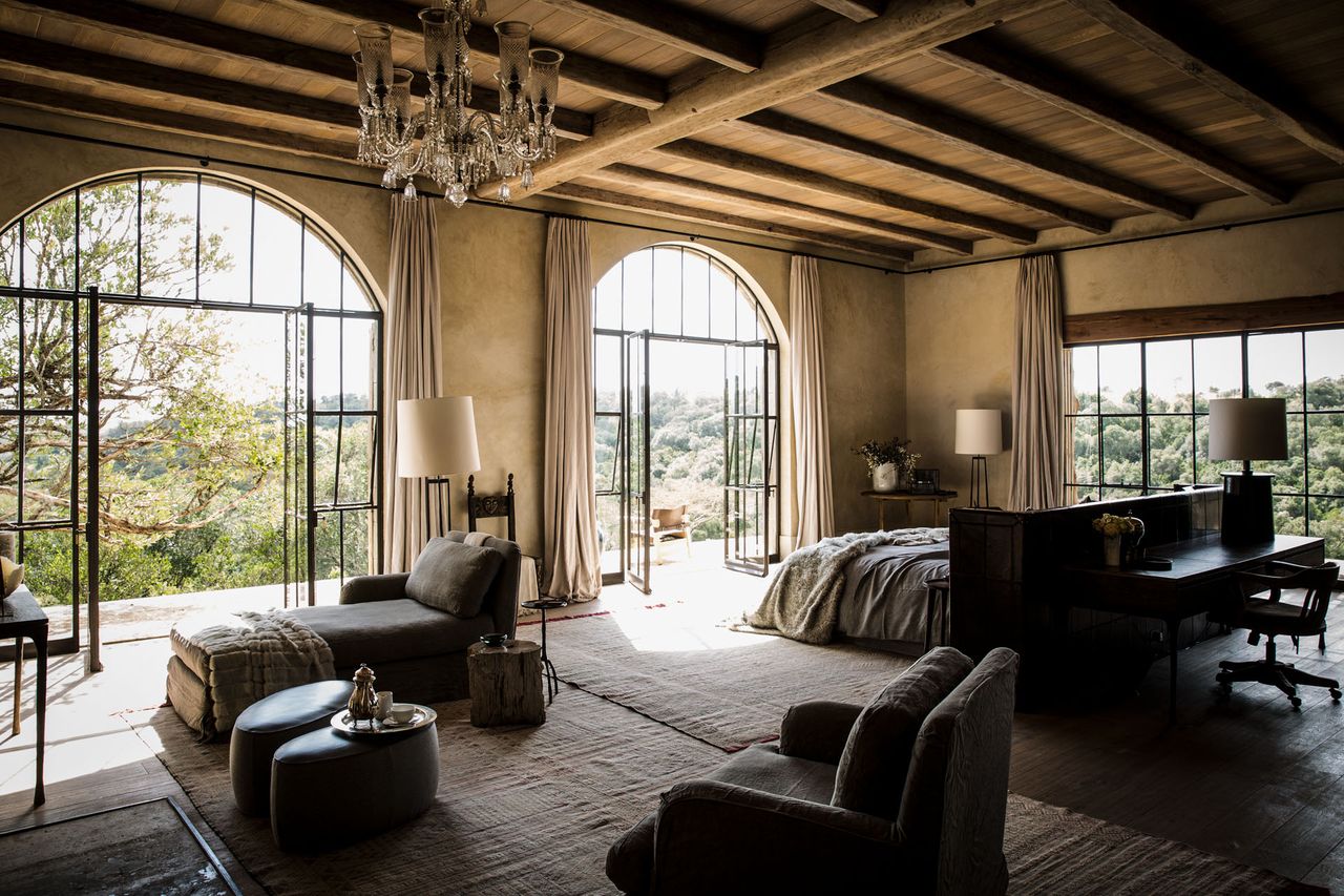 Large glass window and doors in bedroom living room
