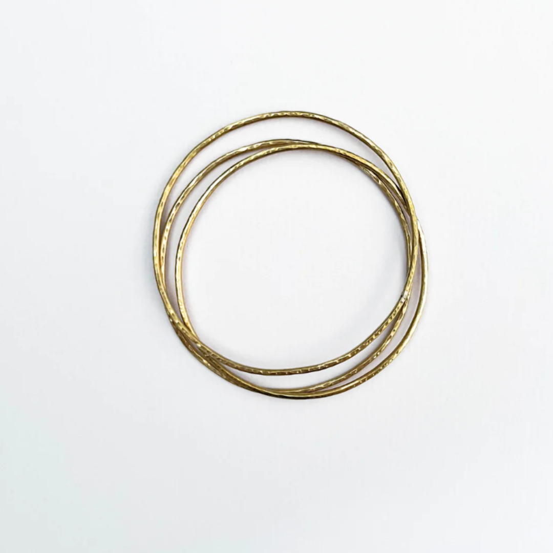 ethical jewellery: three hammered brass bangles
