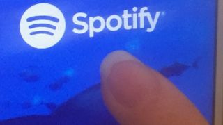 Person using Spotify on their phone