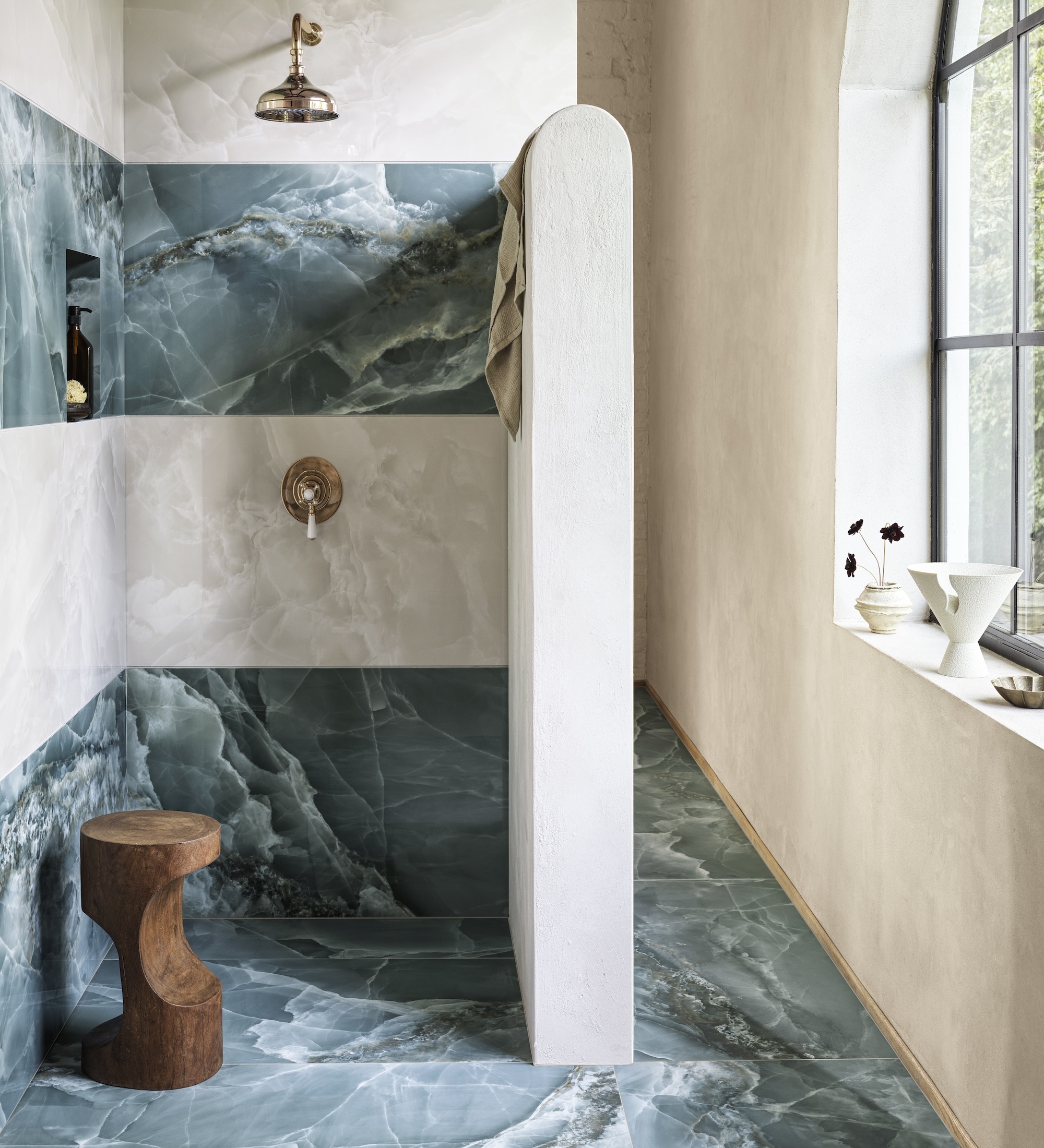 a bathroom with onyx large tiles
