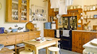 A mix of freestanding and fitted furniture in this wooden farmhouse kitchen