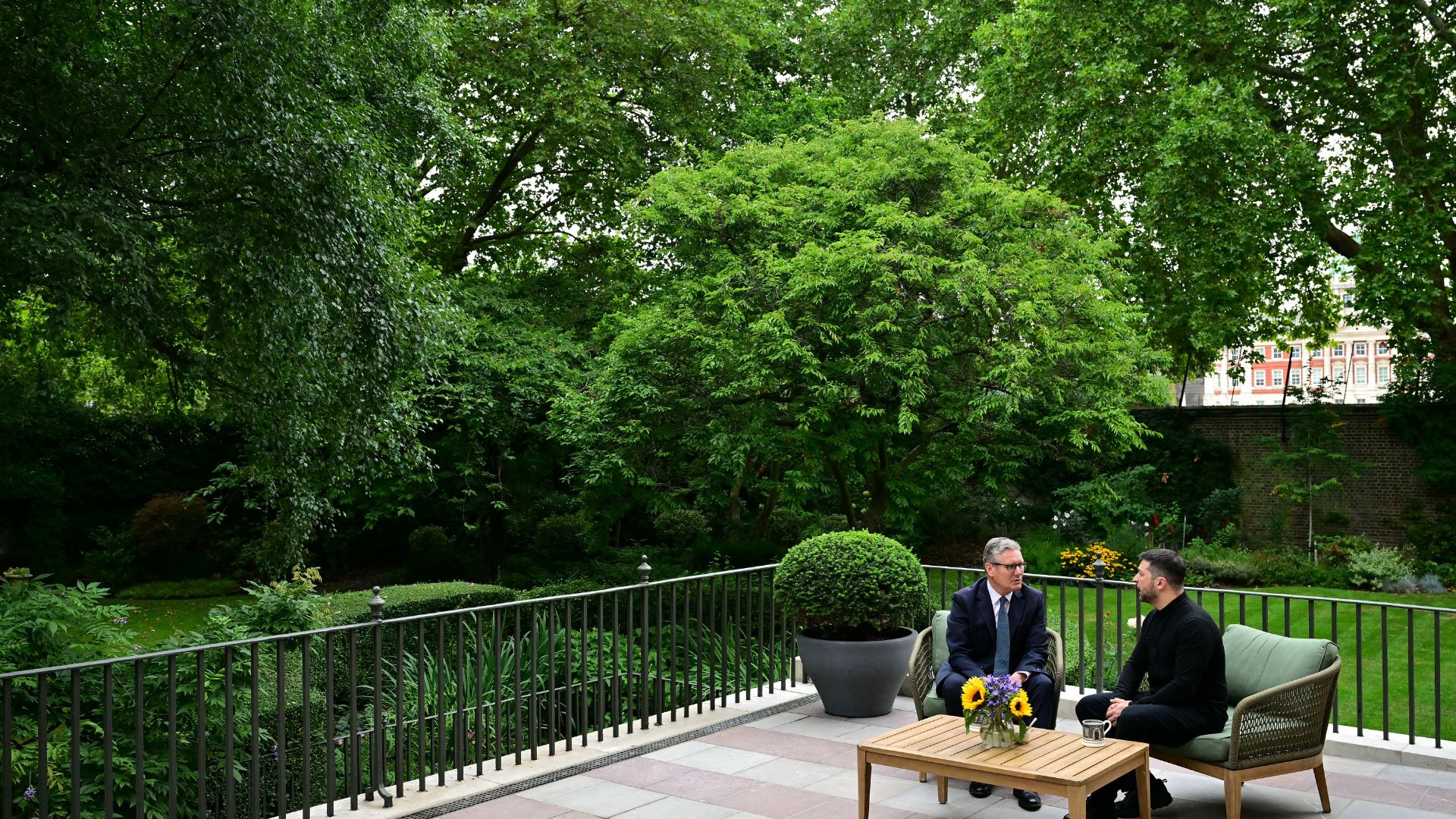 an image of Britain's Prime Minister Keir Starmer with Ukraine's President Volodymyr Zelensky in the garden of 10 Downing Street. (Photo by Ben STANSALL / POOL / AFP via Getty Images)