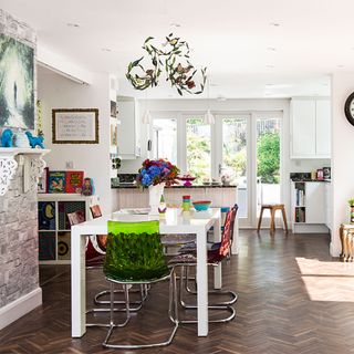 shabby chic kitchen with coloured dining chairs