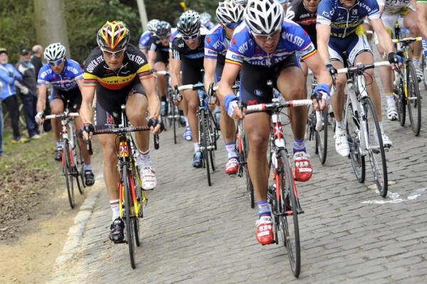 Tom Boonen (Quick Step) and teammate Stijn Devolder ride at the front over the cobbles.