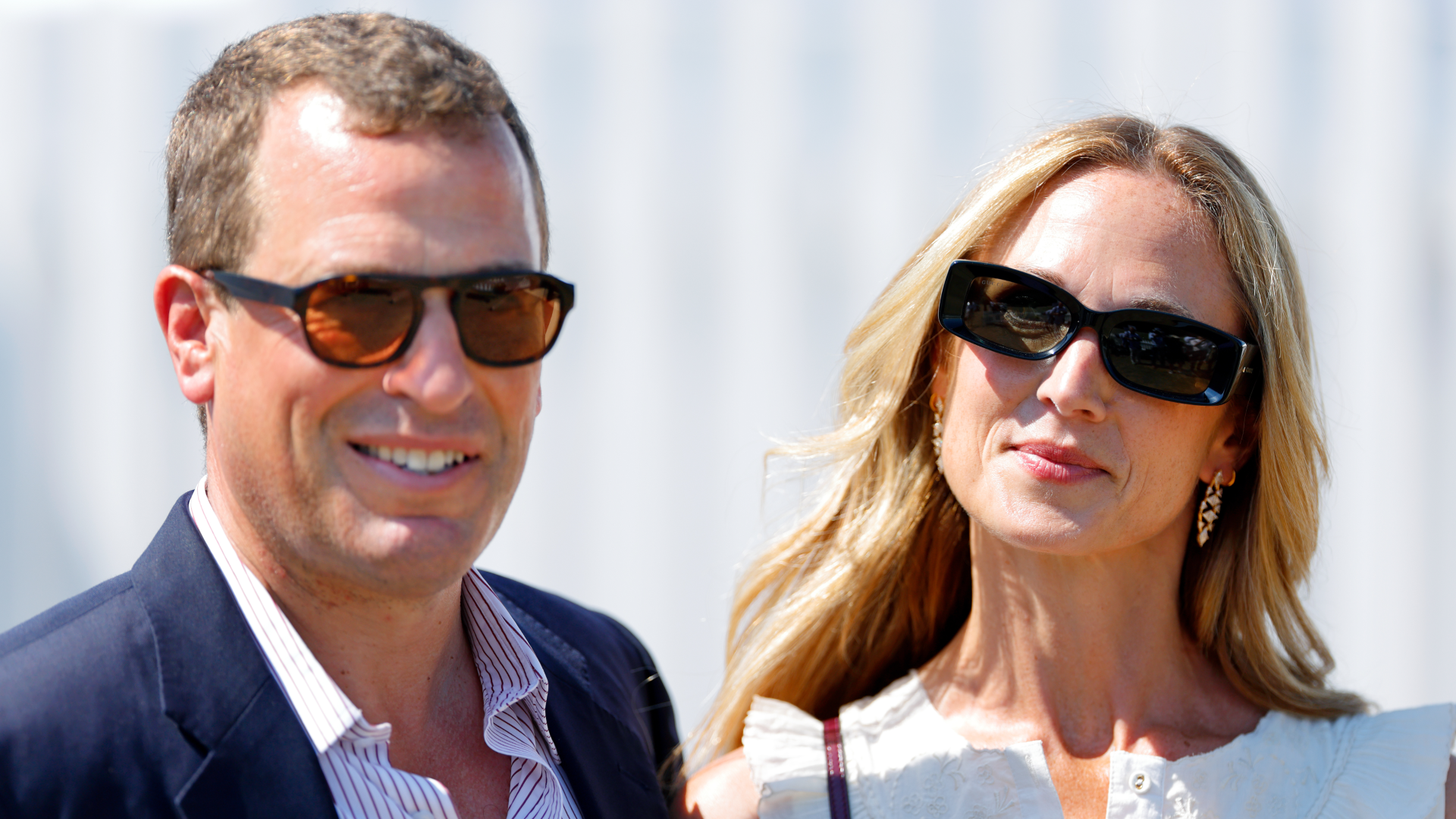 Peter Phillips and Harriet Sperling smiling and wearing sunglasses