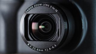 Canon PowerShot V1 on a wooden surface