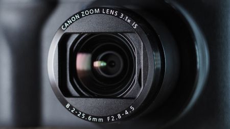 Canon PowerShot V1 on a wooden surface