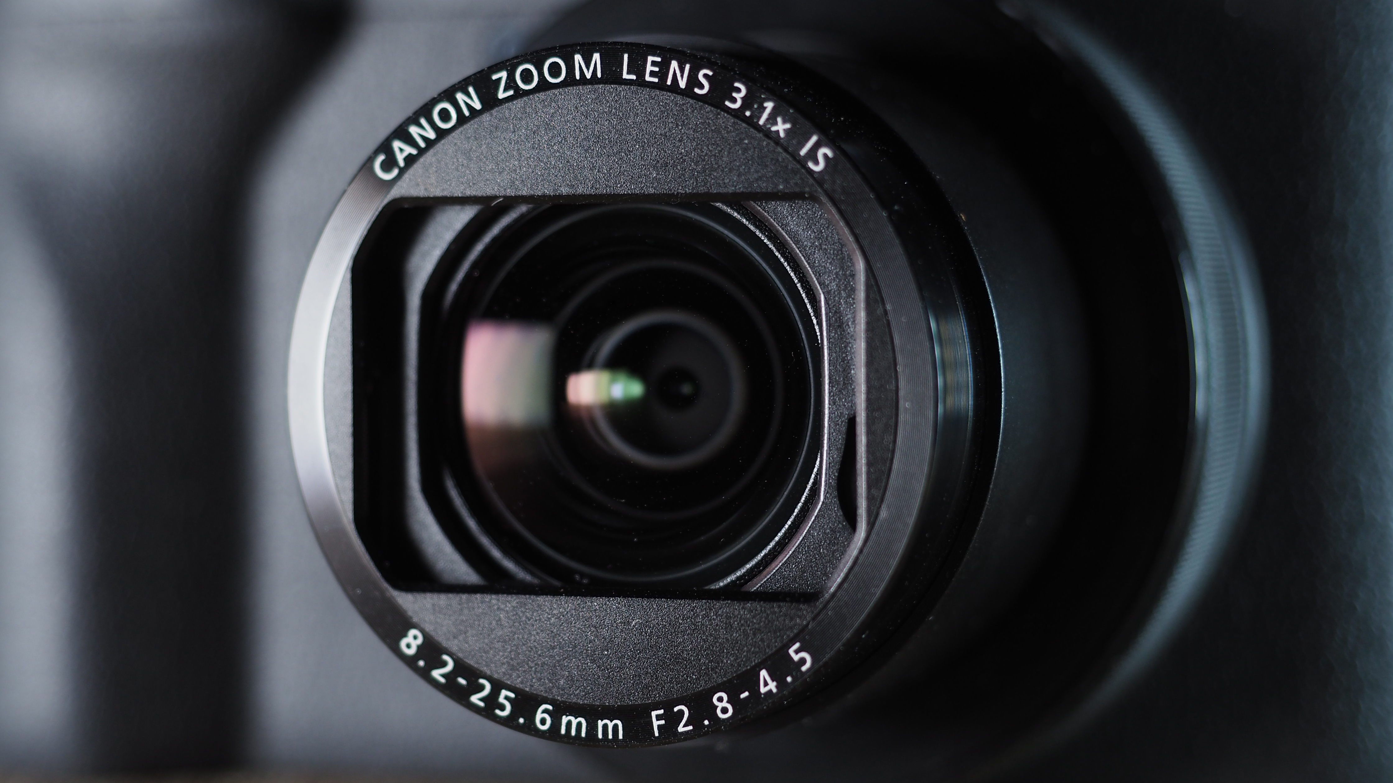 Canon PowerShot V1 on a wooden surface