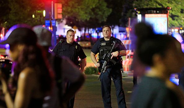 A heavy police presence near the scene of the police shooting Thursday in Dallas.