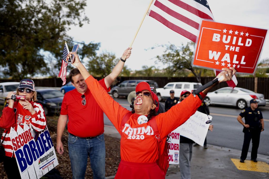 A pro-Trump protester supports his wall in California