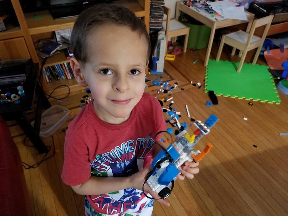 Isaac Building a Lego Boost Robot at Age 5