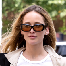 Jennifer Lawrence wears a white T-shirt and oversize shades