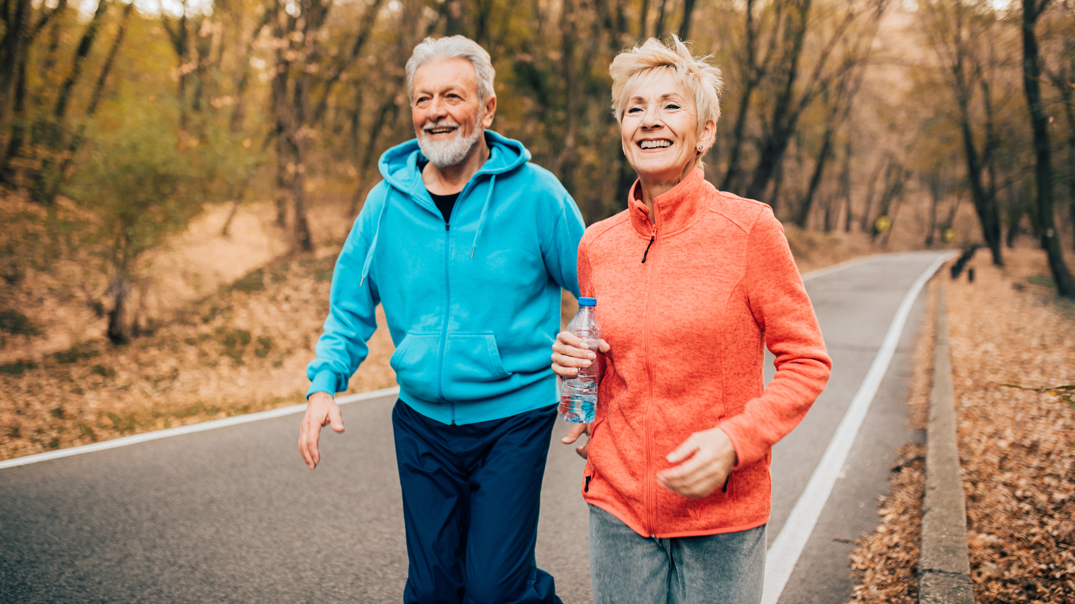 Man and woman walking outside
