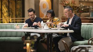 Dan Levy, Sohla El-Waylly and Will Guidara eating at the judges table in The Big Brunch