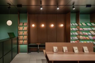 timber and green tones at bookstore in Zhang Taiyan by Tsing-Tien Making
