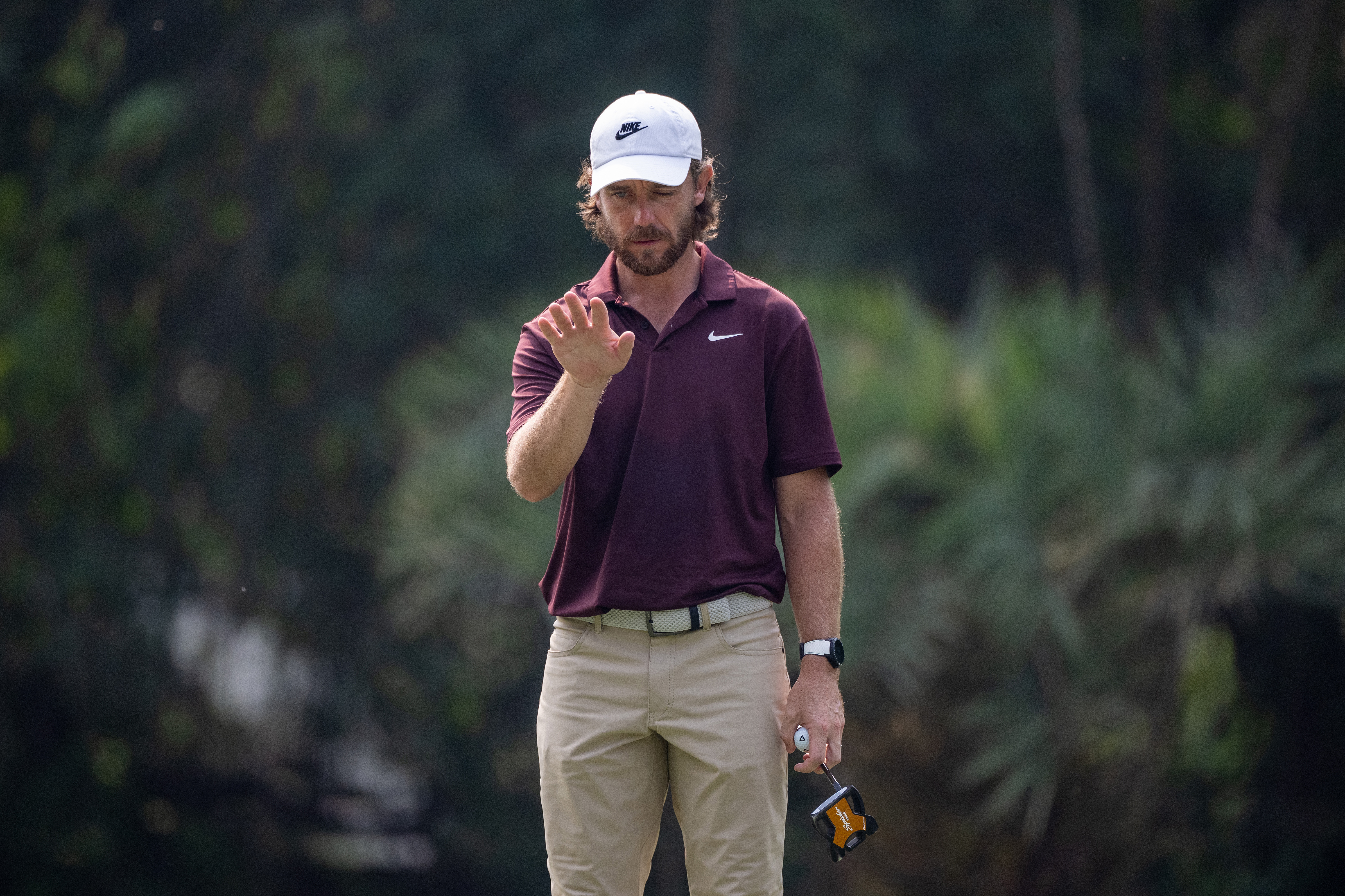 Tommy Fleetwood lines up a putt