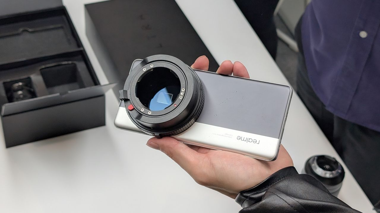 RealMe Interchangeable Lens Concept phone held in a hand