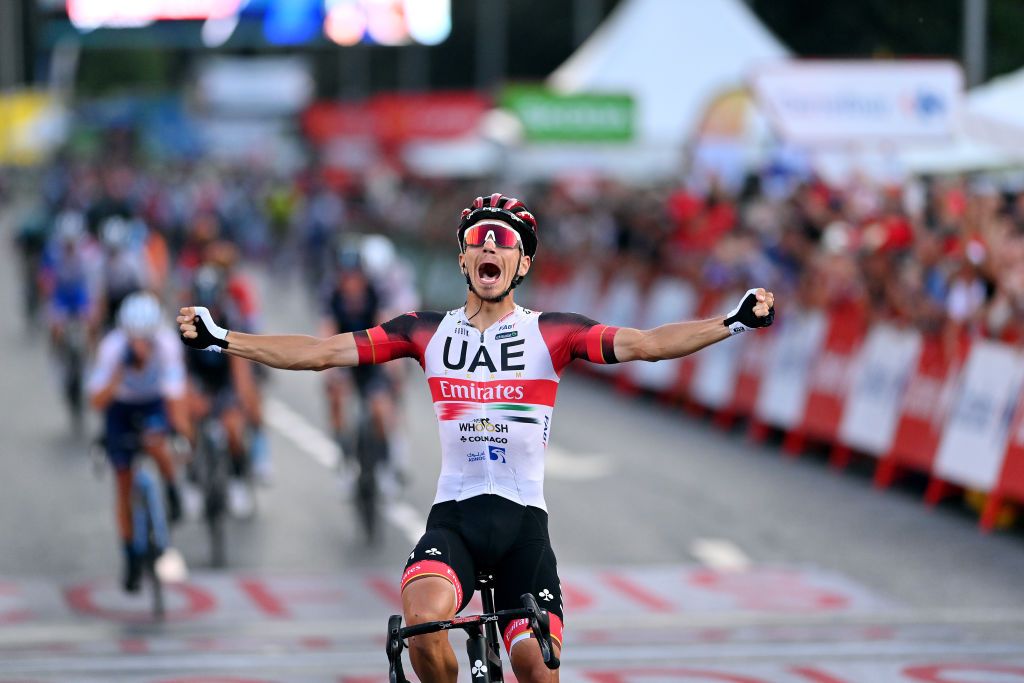 MADRID SPAIN SEPTEMBER 11 Ivo Oliveira of Portugal and UAE Team Emirates celebrates the victory of his teammate Juan Sebastin Molano Benavides of Colombia during the 77th Tour of Spain 2022 Stage 21 a 967km stage from Las Rozas to Madrid LaVuelta22 WorldTour on September 11 2022 in Madrid Spain Photo by Justin SetterfieldGetty Images