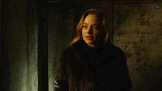 Lindsay Lohan in dark lighting in Among the Shadows