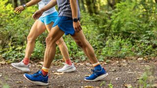 Two people walking on trail wearing KEEN WK400 shoes