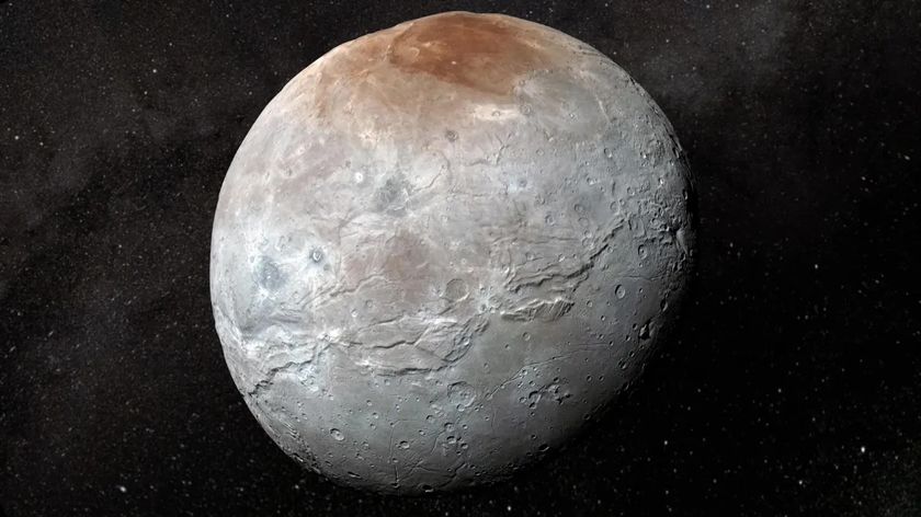 An image of a gray icy moon with a brown spot near the top