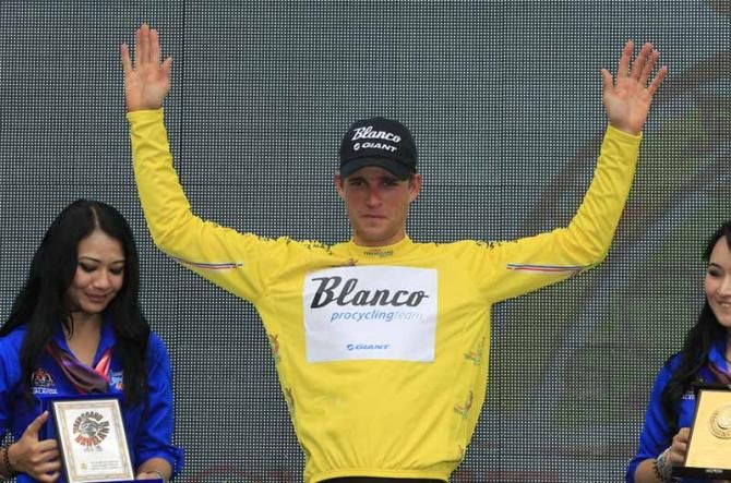 Theo Bos (Blanco) pulls on the yellow jersey at the Tour de Langkawi
