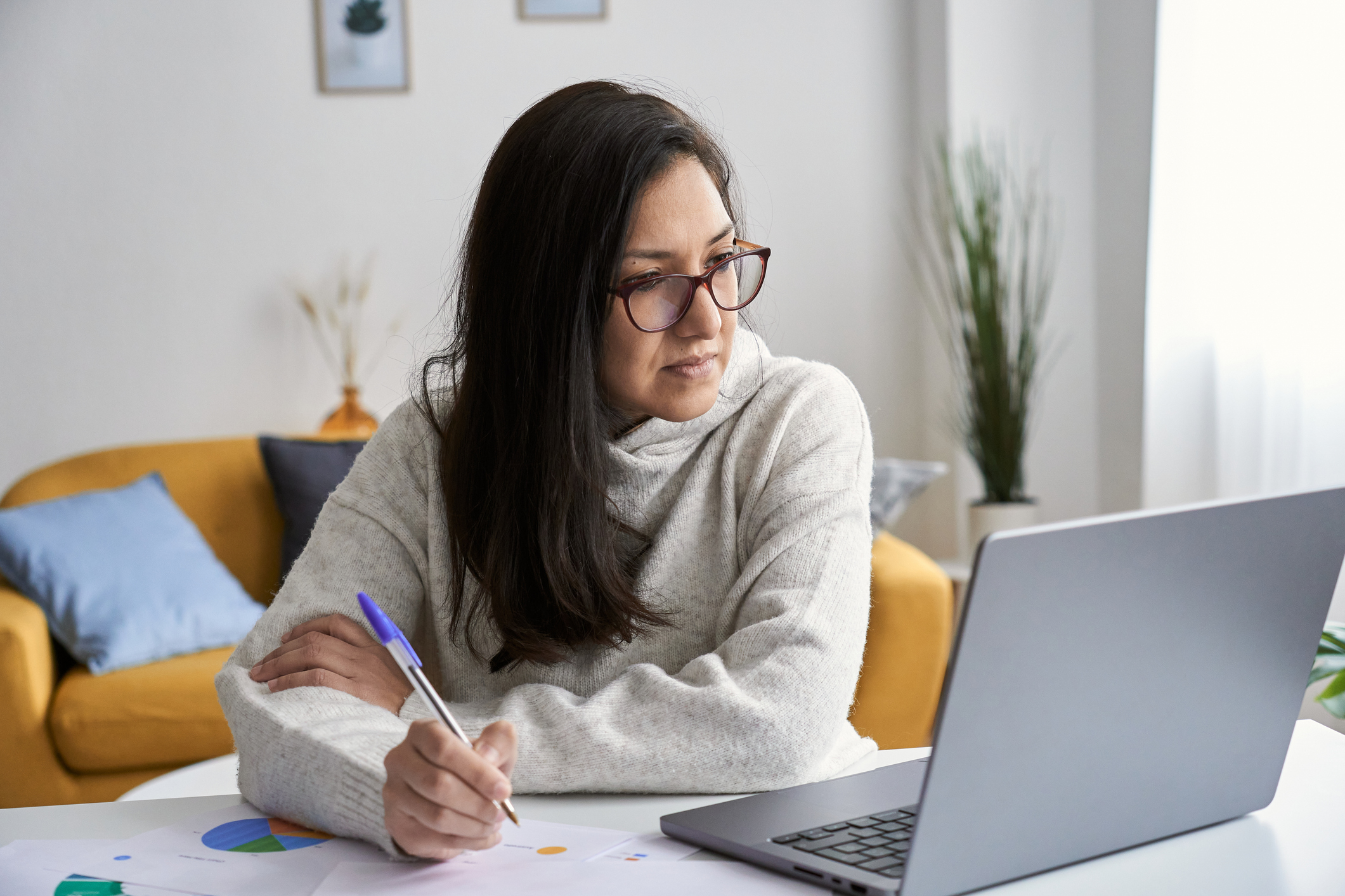 Woman looking at her laptop