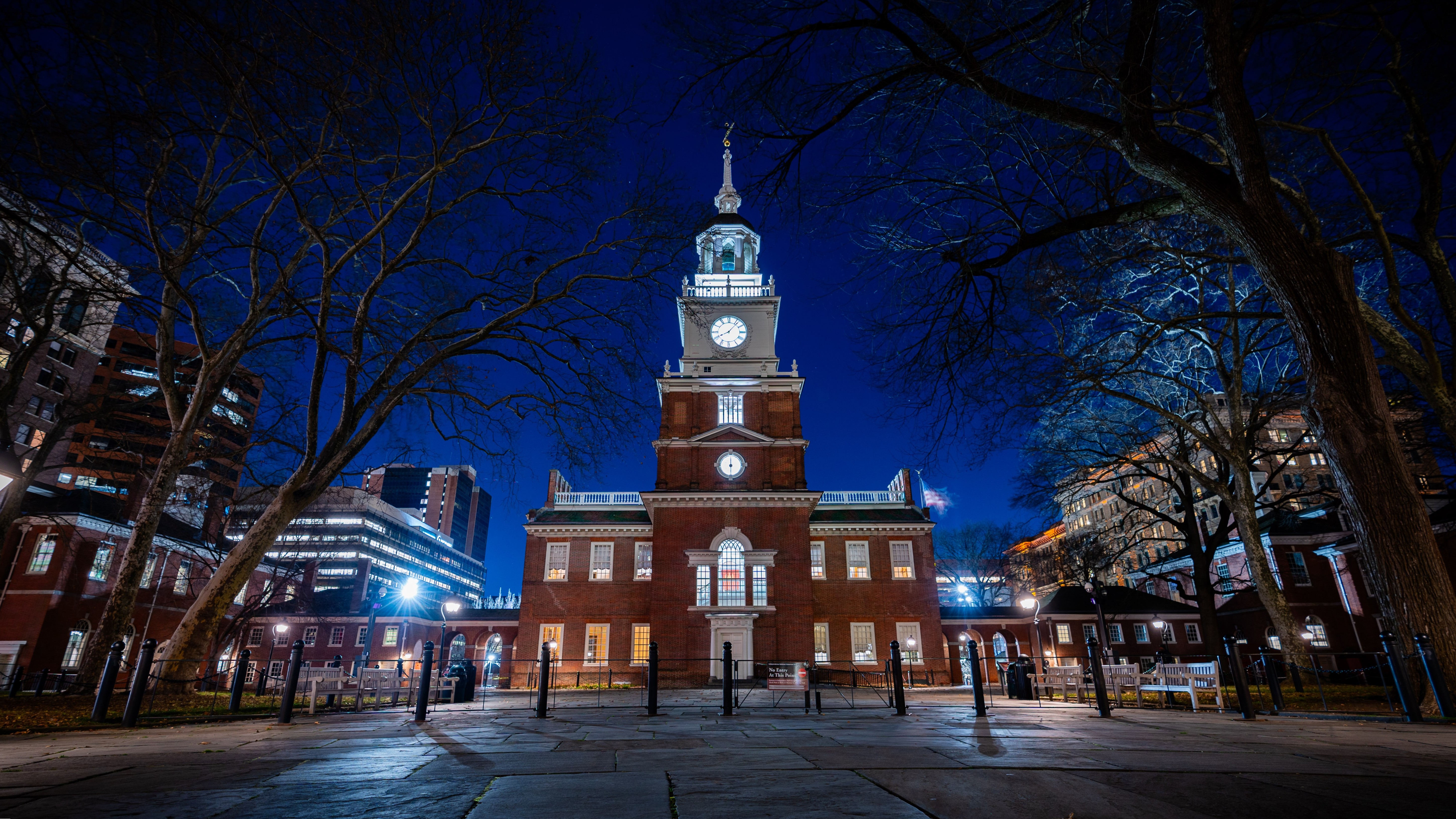 a building with a tower and a clock on it at night.