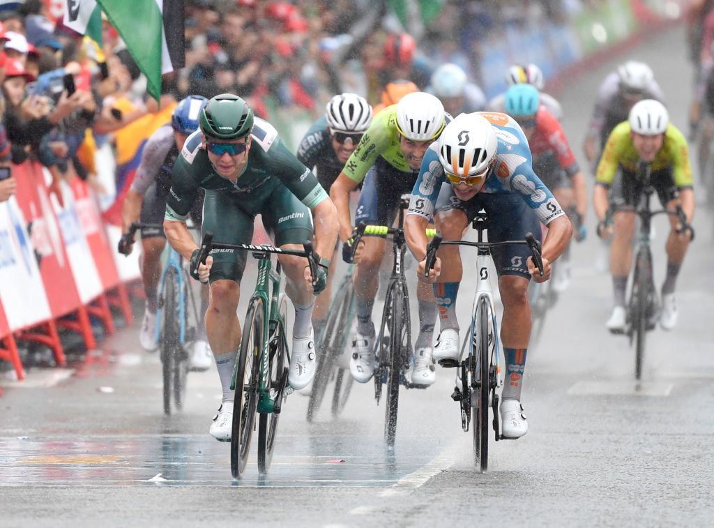 Team Alpecin's Kaden Groves (L) competes with Team DFP's Pavel Bittner and Team Intermarche's Vito Braet (C) ahead of the finish line of the stage 17 of the Vuelta a Espana, a 141,5 km race between Arnuero and Santander, on September 4, 2024. (Photo by Ander Gillenea / AFP)