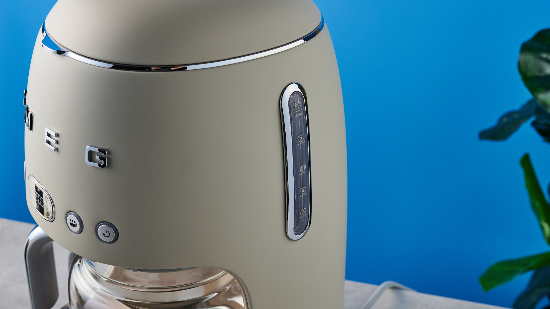 the smeg retro coffee maker photographed against the blue tom's guide background