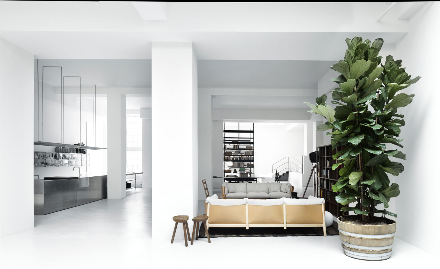 The style of the De Padova home is a mix of minimalism, iconic Italian design and more domestic touches, such as vintage pieces and plants
