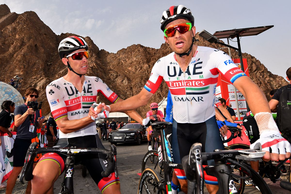 Costa congratulates Kristoff at the finish, you can see the missing chainstay on Kristoff's bike