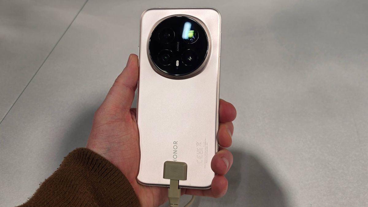 The Honor Magic 8 Pro in a man's hand.