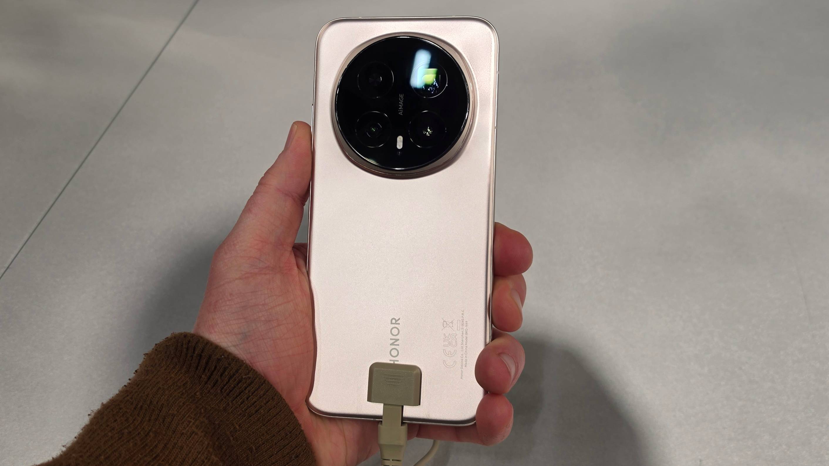 The Honor Magic 8 Pro in a man's hand.