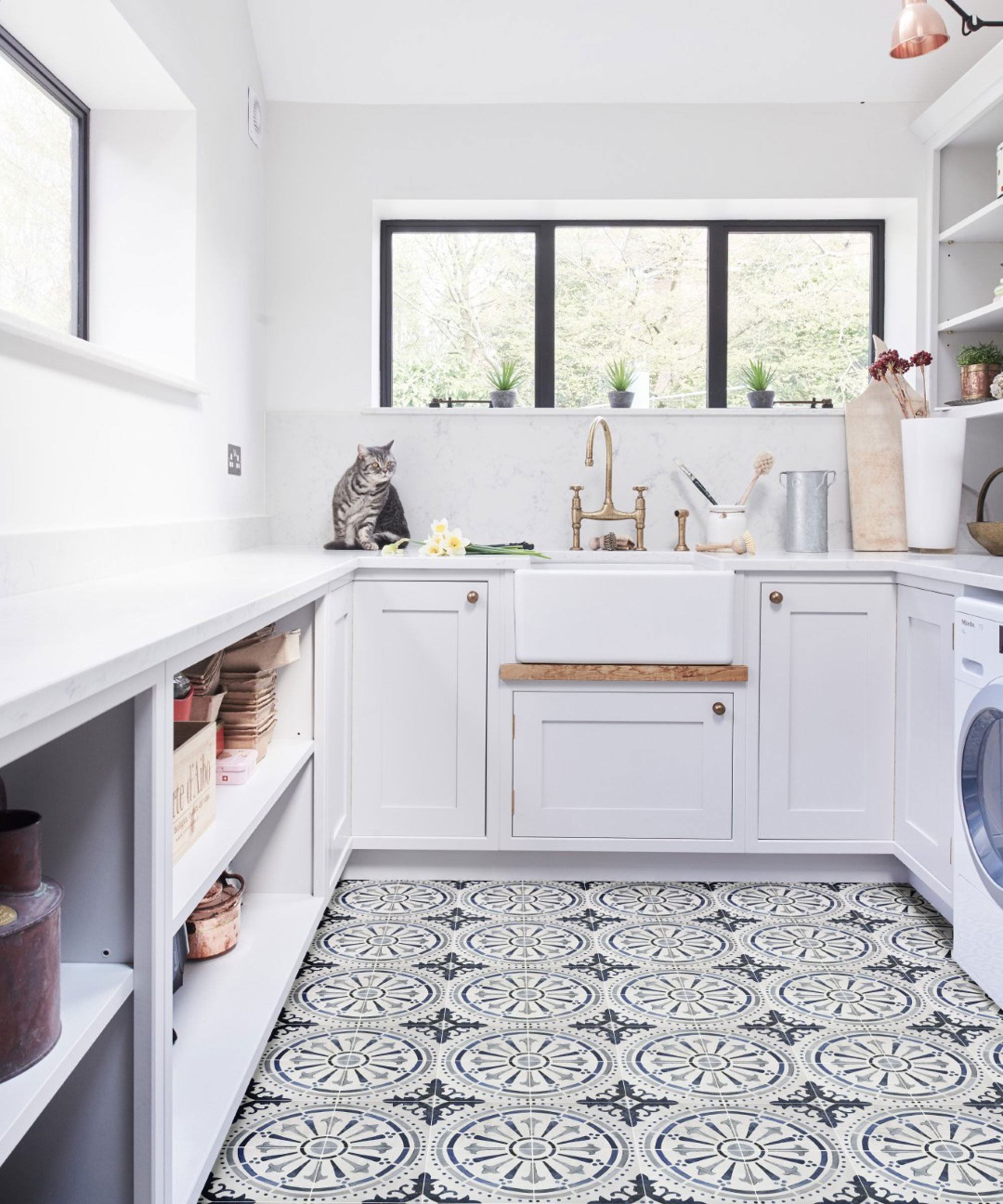 white utility room with patterned tile floor