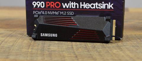 A Samsung 990 Pro on a table in front of its retail packaging