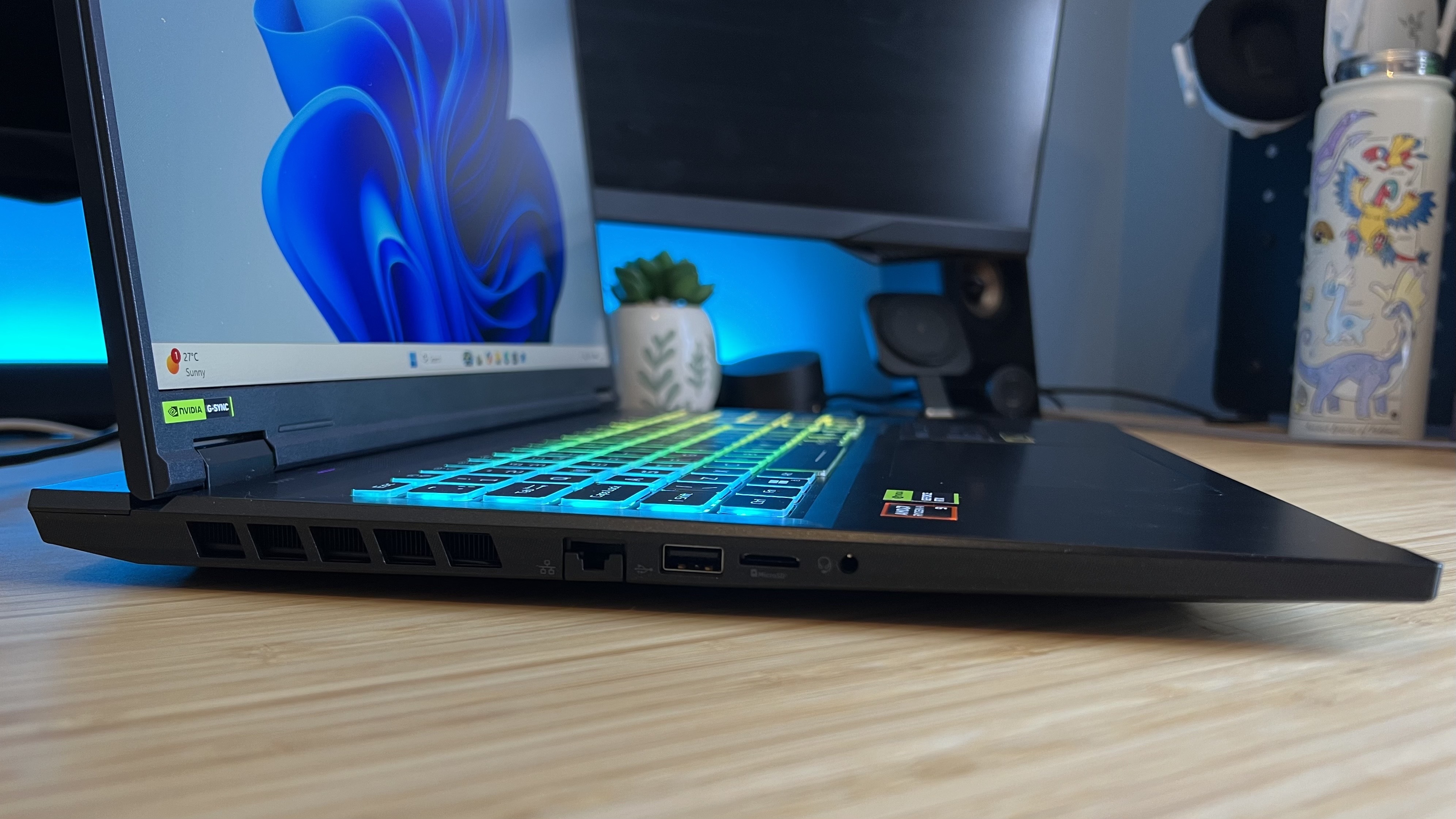 Close up on left side of Acer Nitro 18 AI chassis showing thin tapered lip towards the front edge and relatively slimline venting