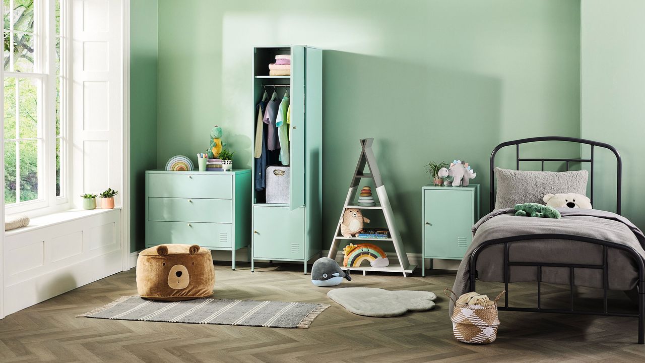 Kids bedroom with green chest of drawers and wardrobe