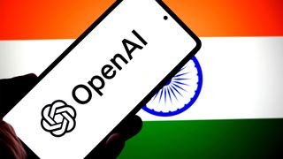 OpenAI logo on a phone in front of an Indian flag.