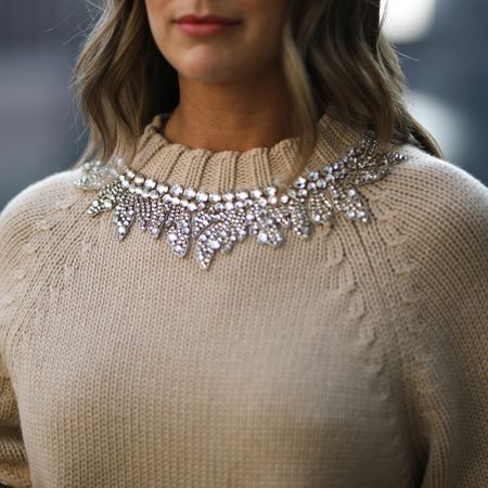 woman wearing a crystal embellished sweater