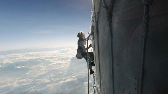 Felicity Jones climbing in The Aeronauts