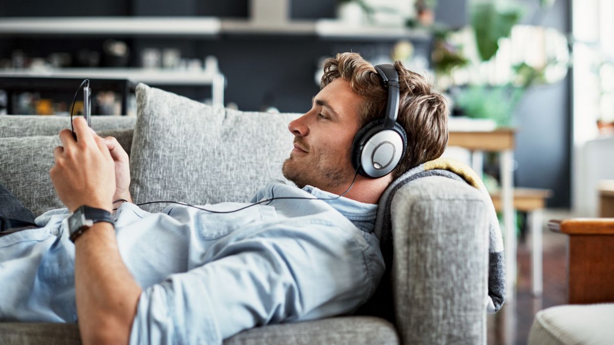 Man listening to music on the sofa