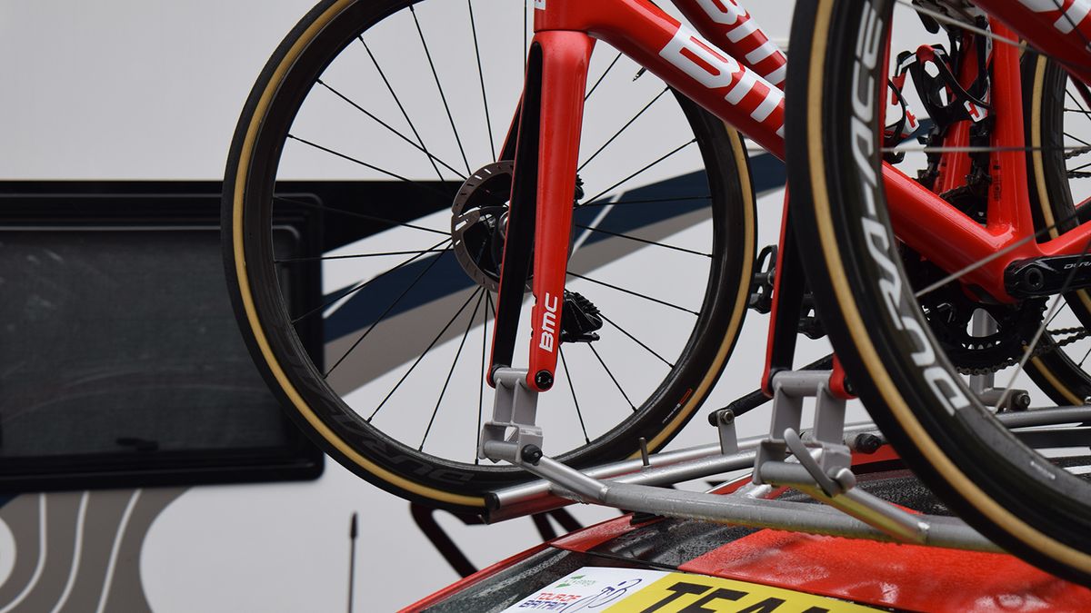 The BMC Racing team car has adapted it's roof rack system to accommodate thru-axle equipped disc brake bikes