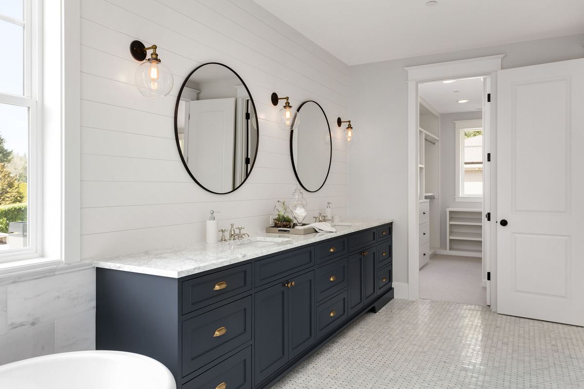 White Bathroom Vanity Brown Counter Blue Walls