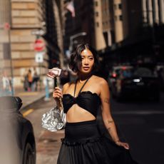 woman in a black two piece dress
