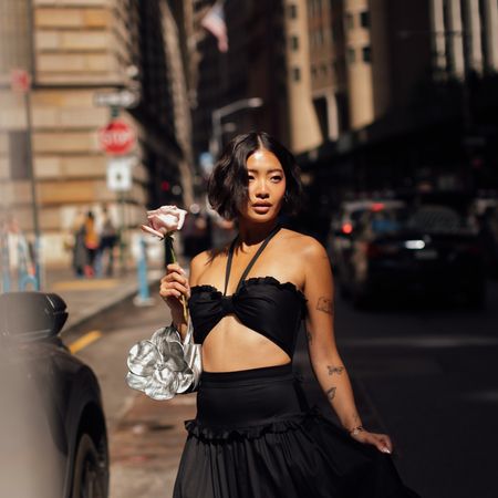 woman in a black two piece dress