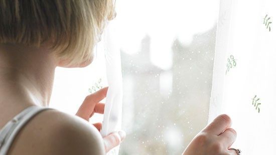 girl looking out of window 